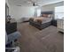 King bedroom with dresser and seating area at 16425 W Latham St, Goodyear, AZ 85338