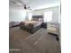 Comfortable bedroom with king-size bed and crib at 16425 W Latham St, Goodyear, AZ 85338