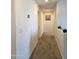 Upstairs hallway with carpeted floor and artwork at 16425 W Latham St, Goodyear, AZ 85338