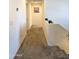 Upstairs hallway with carpeted flooring and neutral walls at 16425 W Latham St, Goodyear, AZ 85338