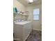 Laundry room with washer, dryer and shelving at 16425 W Latham St, Goodyear, AZ 85338