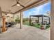 Covered patio with seating area and grassy backyard at 16833 S 177Th Ln, Goodyear, AZ 85338