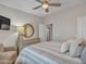 Bedroom with dresser, ceiling fan, and calming decor at 16833 S 177Th Ln, Goodyear, AZ 85338