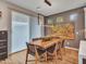 Modern dining room with a wood table and leather chairs at 16833 S 177Th Ln, Goodyear, AZ 85338