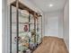 Bright entryway with glass shelves and wood floors at 16833 S 177Th Ln, Goodyear, AZ 85338