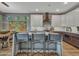 Modern kitchen with breakfast bar and white cabinets at 16833 S 177Th Ln, Goodyear, AZ 85338