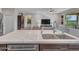 Kitchen island with quartz countertop and double sink at 16833 S 177Th Ln, Goodyear, AZ 85338