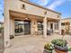 Covered patio with flagstone flooring, seating area, and ceiling fan at 16833 S 177Th Ln, Goodyear, AZ 85338