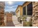 Relaxing patio area with wicker chairs and stone accents at 17164 S 174Th Dr, Goodyear, AZ 85338