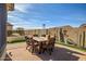 Outdoor dining area with a table and chairs, perfect for al fresco meals at 17164 S 174Th Dr, Goodyear, AZ 85338