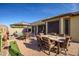 Backyard with a refreshing pool, dining area, and ample seating at 17164 S 174Th Dr, Goodyear, AZ 85338