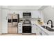 Modern kitchen featuring stainless steel appliances and white shaker cabinets at 1718 S Longmore -- # 52, Mesa, AZ 85202