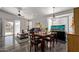 Bright dining room with a wood table and chairs, and a large fish tank at 1823 E Riviera Dr, Chandler, AZ 85249