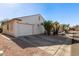 Single story home with white garage door and desert landscaping at 1823 E Riviera Dr, Chandler, AZ 85249