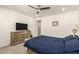 Main bedroom with dresser and ceiling fan at 1852 E Chelsea Ln # 102, Gilbert, AZ 85295