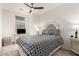 Charming bedroom with plaid bedding and ceiling fan at 1852 E Chelsea Ln # 102, Gilbert, AZ 85295