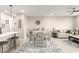 Dining area with white table and chairs, open to the kitchen at 1852 E Chelsea Ln # 102, Gilbert, AZ 85295