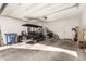 Large garage with golf cart and various items at 1852 E Chelsea Ln # 102, Gilbert, AZ 85295