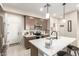 Modern kitchen with island, stainless steel appliances, and white counters at 1852 E Chelsea Ln # 102, Gilbert, AZ 85295