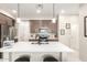 Modern kitchen with dark wood cabinets and a large island at 1852 E Chelsea Ln # 102, Gilbert, AZ 85295