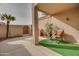 Private backyard with artificial turf and rocking chair at 18619 N 136Th Dr, Sun City West, AZ 85375