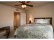 Bright bedroom with a double bed and access to a bathroom at 18619 N 136Th Dr, Sun City West, AZ 85375