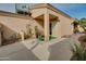 Ground level view of the back exterior, showing a patio and walkway at 18619 N 136Th Dr, Sun City West, AZ 85375