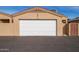 Attached single car garage with white roll up door at 18619 N 136Th Dr, Sun City West, AZ 85375