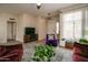 Living room with open floor plan and view into kitchen at 18619 N 136Th Dr, Sun City West, AZ 85375