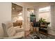 Relaxing reading nook with comfy chair and large window at 18619 N 136Th Dr, Sun City West, AZ 85375