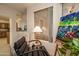 Relaxing reading nook with comfy chair and large window at 18619 N 136Th Dr, Sun City West, AZ 85375