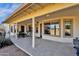 Covered patio with seating area, adjacent to the house at 1902 E Bruce Ave, Gilbert, AZ 85234