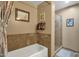 Bathroom features a soaking tub, a walk-in shower, and updated tile at 1902 E Bruce Ave, Gilbert, AZ 85234