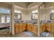 Double vanity bathroom with large mirrors and spacious layout at 1902 E Bruce Ave, Gilbert, AZ 85234