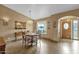 Bright dining area with a round wooden table and four chairs at 1902 E Bruce Ave, Gilbert, AZ 85234