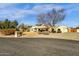 Single-story home with a large front yard, driveway, and two-car garage at 1902 E Bruce Ave, Gilbert, AZ 85234