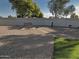 Backyard features a fire pit, sitting bench, and artificial turf at 19203 N Marbella Ave, Maricopa, AZ 85138