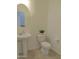 Clean bathroom with pedestal sink and tile floor at 19203 N Marbella Ave, Maricopa, AZ 85138