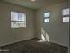 Well-lit bedroom featuring carpeted floors at 19203 N Marbella Ave, Maricopa, AZ 85138