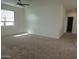 Bright bedroom with carpeted floor and ceiling fan at 19203 N Marbella Ave, Maricopa, AZ 85138