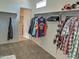 Spacious walk-in closet with ample hanging space at 19203 N Marbella Ave, Maricopa, AZ 85138