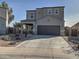 Two-story house with a two-car garage and desert landscaping at 19203 N Marbella Ave, Maricopa, AZ 85138