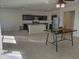 Open concept kitchen and dining with tile floors at 19203 N Marbella Ave, Maricopa, AZ 85138