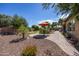 Backyard patio with seating area and desert landscaping at 19334 W Pasadena Ave, Litchfield Park, AZ 85340