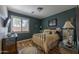 Bedroom with metal bed frame and wood flooring at 19334 W Pasadena Ave, Litchfield Park, AZ 85340