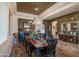 Elegant dining room with hardwood floors and chandelier at 19334 W Pasadena Ave, Litchfield Park, AZ 85340