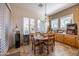 Charming kitchen nook with wood table and built-in cabinetry at 19334 W Pasadena Ave, Litchfield Park, AZ 85340