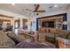 Bright and airy living room with built-in entertainment center at 19334 W Pasadena Ave, Litchfield Park, AZ 85340