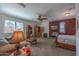 Main bedroom with seating area and wood floors at 19334 W Pasadena Ave, Litchfield Park, AZ 85340