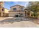 Two-story house with a double garage and a landscaped front yard at 2016 N Ensenada Ln, Casa Grande, AZ 85122